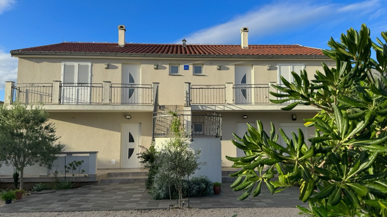 Villa Emilia exterior with garden and olive trees